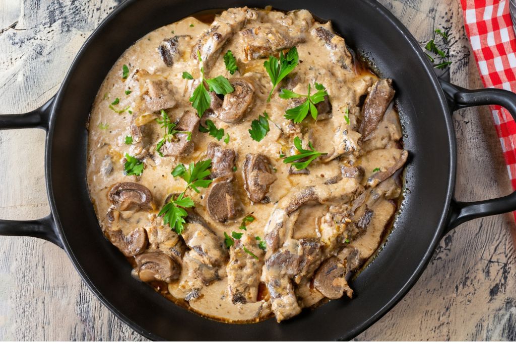 Beef stroganoff is a popular dish made with tender strips of sirloin beef sautéed with onions and mushrooms, all simmered in a rich, creamy sauce made with sour cream.